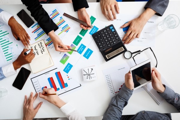 businessmen-hands-white-table-with-documents-drafts-1